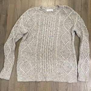 Grey cable knit sweater. Crew neck, colorful fleks throughout.